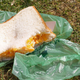 One of Augusta National's famed pimento cheese sandwiches resting on a green wrapper
